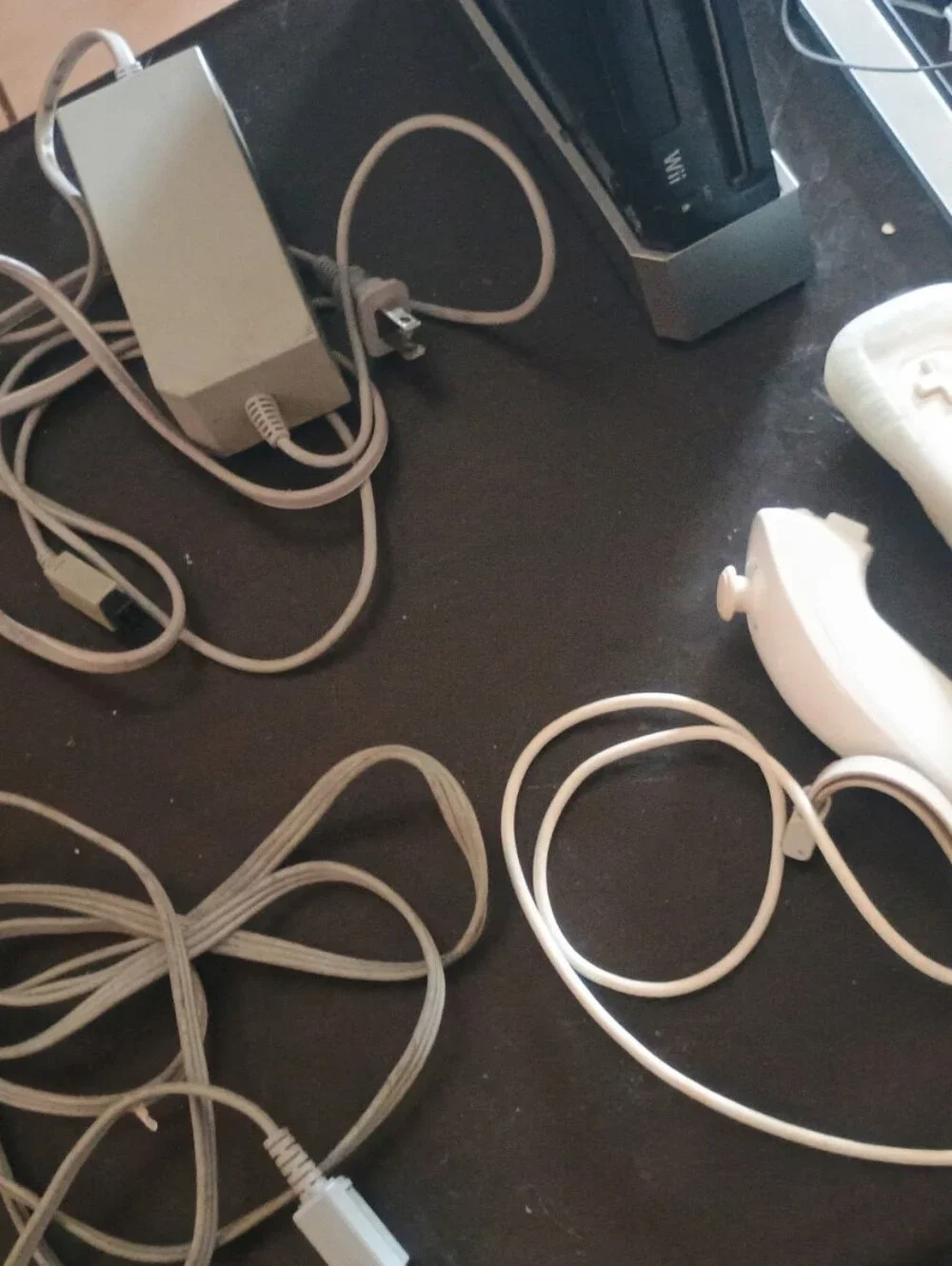 Nintendo Wii Bundle with 4 Games Black Console and White Controllers